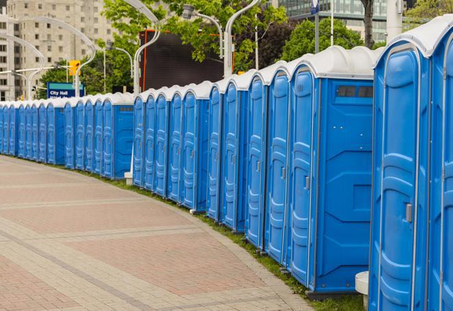 a clean row of portable restrooms for outdoor weddings or festivals in Bernardsville